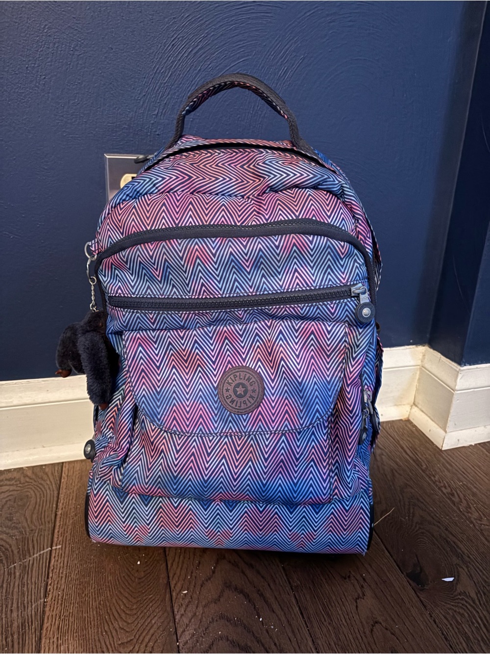 Kipling Rolling Backpack in Pink and Blue